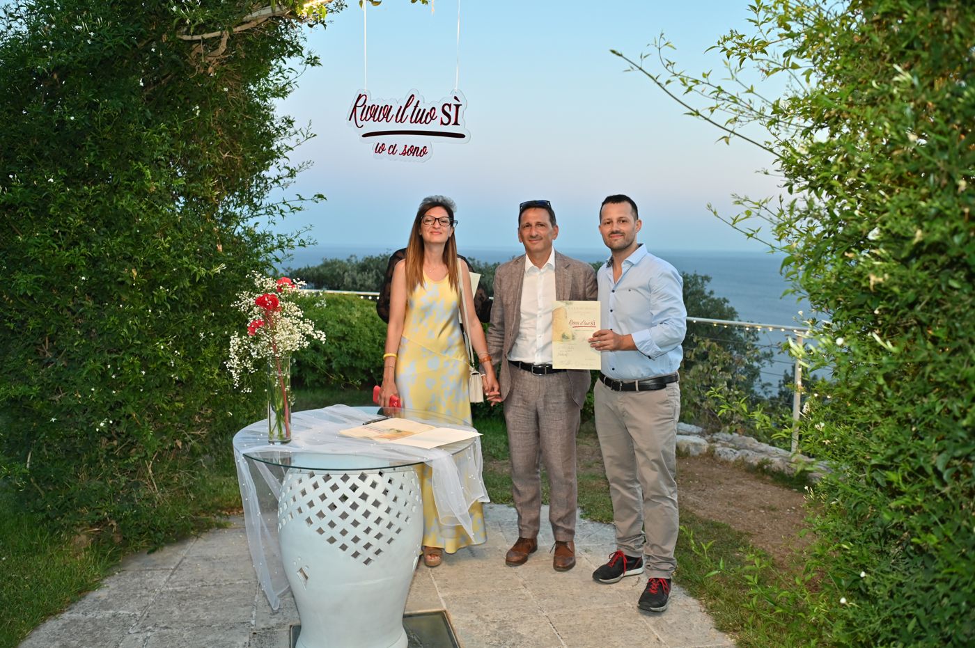 Handing the certificate to the couples renewing their vows