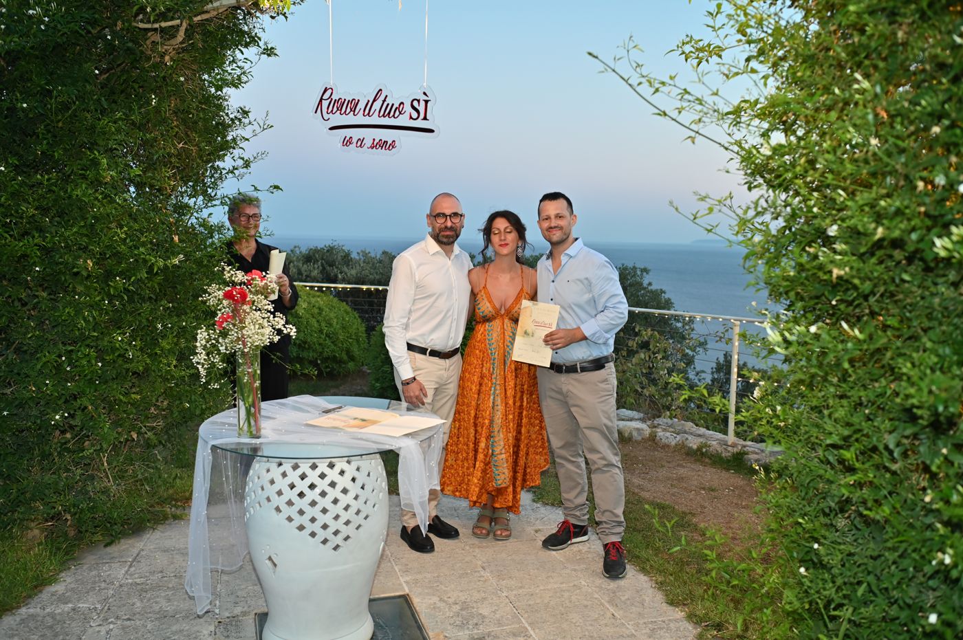 Handing the certificate to the couples renewing their vows
